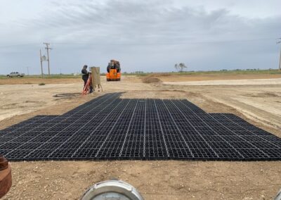 Laying EcoRaster - ground stabilization before jack set - Prairie Gold Pumpjack Services